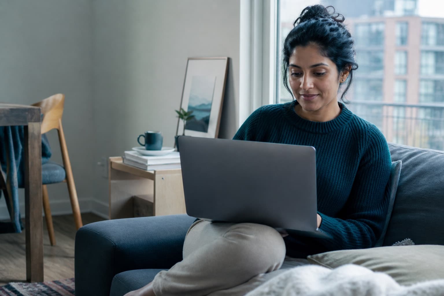 A woman preparing for a private virtual women's-health conversation at home